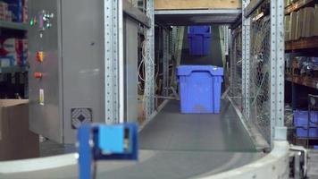 Packaging lines with plastic blue boxes video