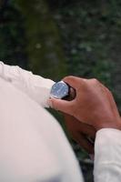 Man's watch on hand. Wedding ceremony photo