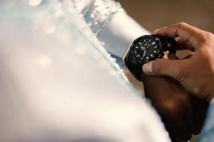 Man's watch on hand. Wedding ceremony photo