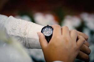 Man's watch on hand. Wedding ceremony photo