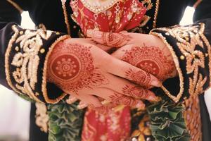 Bride henna carved beautiful and unique at bride's hand photo