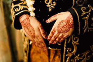 Bride henna carved beautiful and unique at bride's hand photo