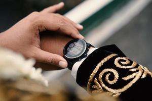 Man's watch on hand. Wedding ceremony photo