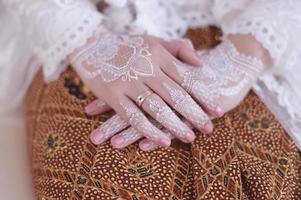 Bride henna carved beautiful and unique at bride's hand photo