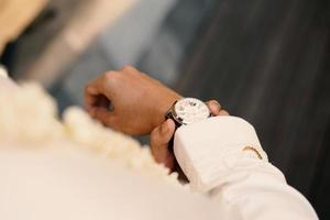 Man's watch on hand. Wedding ceremony photo