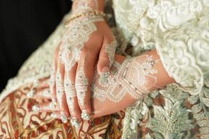 Bride henna carved beautiful and unique at bride's hand photo