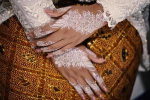 Bride henna carved beautiful and unique at bride's hand photo