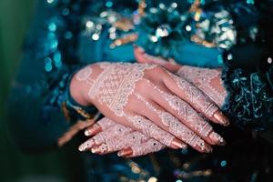 Bride henna carved beautiful and unique at bride's hand photo