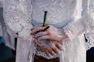 Bride henna carved beautiful and unique at bride's hand photo