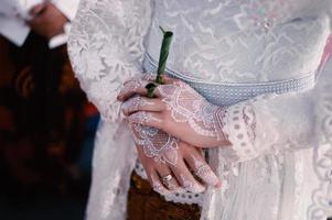 Bride henna carved beautiful and unique at bride's hand photo