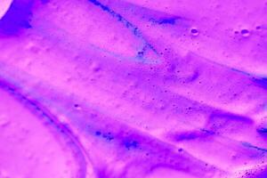 abstract light purple beautiful liquid marble fluid acrylic paint vibrant texture on purple. photo