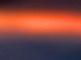 Resumen luz colorida naranja sutil borrosa hermosa suave textura brillante degradado. foto