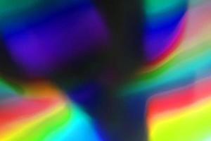 Superficie de efecto abstracto de papel degradado de arco iris holográfico con lámina arrugada de color. foto