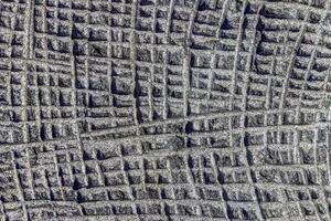 Adorno de textura realista de pared cuadrada de piedra gris abstracta construyendo roca en la naturaleza. foto