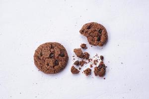 Chocolate cookies on a white table photo