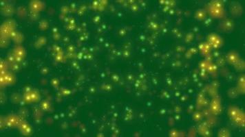 Abstract motion green background shining yellow particles video