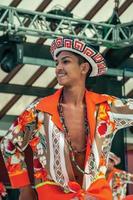 Nova Petropolis, Brazil - July 20, 2019. Brazilian male folk dancer performing a typical dance on 47th International Folklore Festival of Nova Petropolis. A rural town founded by German immigrants. photo