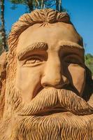 Nova Petropolis, Brazil - July 20, 2019. Sandstone sculpture of a man with bearded face at the Sculpture Park Stones of Silence near Nova Petropolis. A lovely rural town founded by German immigrants. photo