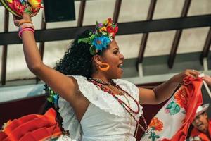 Nova Petropolis, Brazil - July 20, 2019. Brazilian female folk dancer performing a typical dance on 47th International Folklore Festival of Nova Petropolis. A rural town founded by German immigrants. photo