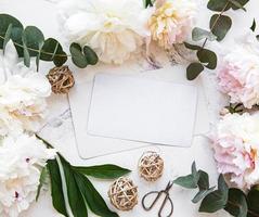 Wedding invitation with pink peonies photo