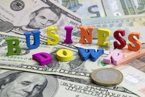 The word business on the banknotes and coins. photo