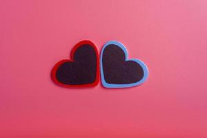 Valentine's Day, Mother's Day, Birthday. Two decorative hearts in the middle on a pink background photo