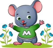 The happy mouse is wearing the alphabet sweater in the garden vector