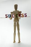 Success and wooden man. photo