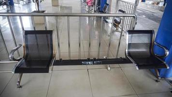 Semarang, Central Java, Indonesia, 2021 - waiting chairs installed during the pandemic at terminal photo