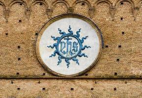 Christogram at Palazzo Publico in Siena, Italy photo