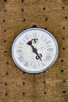 Clock on Palazzo Pubblico clock tower in Siena, Italy photo