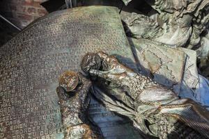 Dusseldorf, Germany, 2015 - Detail of the Monument of grant privileges of Dusseldorf. This bronze monument showing Dusseldorf history was built in 1988 by artist Bert Gerresheim photo