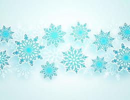 Winter vector background with falling snowflakes of different shapes in white background with empty space for text. Vector illustration.