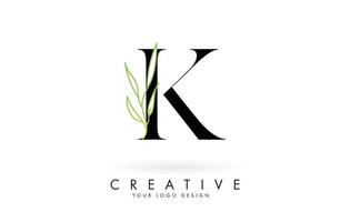 Elegant K letter logo design with long leaves branch vector illustration.