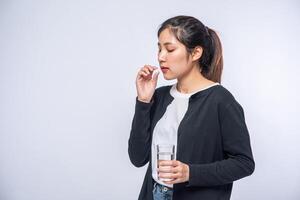 Women who are unwell and are about to take antibiotics. photo