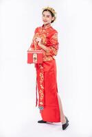 the red bag is very beautiful for lucky woman who get award from company in chinese new year photo