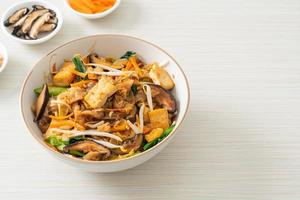 stir-fried noodles with tofu and vegetables photo