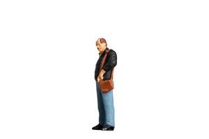 Miniature people Old man holding a shoulder bag  standing on white background with clipping path photo