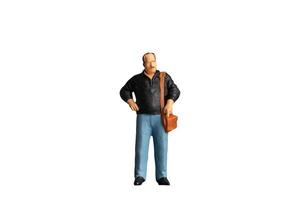 Miniature people Old man holding a shoulder bag  standing on white background with clipping path photo