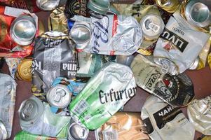 KIEV, UKRAINE - DECEMBER 22, 2021 Crumpled beer cans for scrap