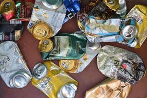 KIEV, UKRAINE - DECEMBER 22, 2021 Crumpled beer cans for scrap photo