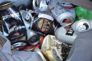 KIEV, UKRAINE - DECEMBER 22, 2021 Crumpled beer cans for scrap photo