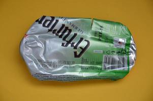 KIEV, UKRAINE - DECEMBER 22, 2021 Crumpled beer cans for scrap photo