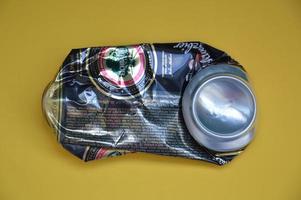 KIEV, UKRAINE - DECEMBER 22, 2021 Crumpled beer cans for scrap photo