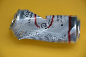 KIEV, UKRAINE - DECEMBER 22, 2021 Crumpled beer cans for scrap photo