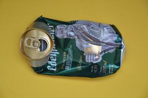 KIEV, UKRAINE - DECEMBER 22, 2021 Crumpled beer cans for scrap photo