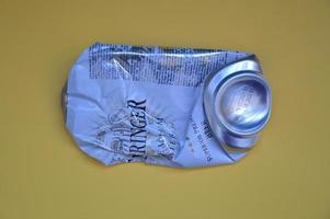 KIEV, UKRAINE - DECEMBER 22, 2021 Crumpled beer cans for scrap photo