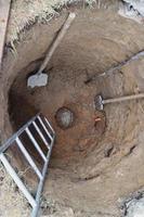 water well top view, with hand construction tool photo
