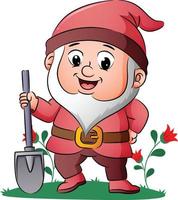 The dwarf is standing and holding the shovel in the garden vector