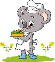 The koala chef is serving a chicken in the garden vector